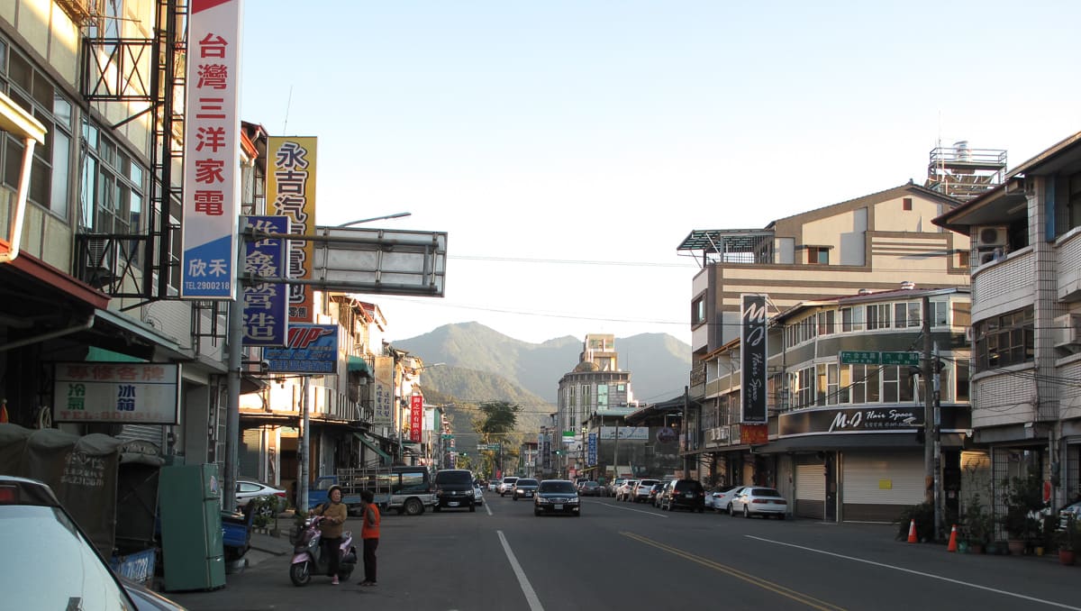 The town of Puli in its basin, ringed by green hills